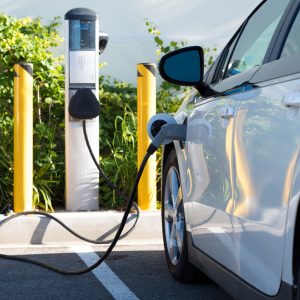 An electric car charging in California